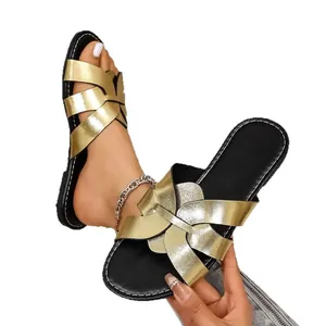 Elegante goldene flache Sandalen mit überkreuzten Riemen für Damen schicke Sommermode