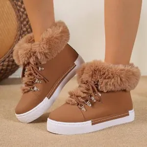 Stylish brown leather snow boots with fluffy faux fur trim and warm plush lining inside.