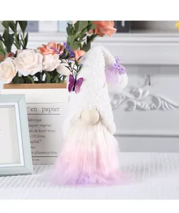 Detail view of a cute plush gnome with pink and purple gradient beard and butterfly