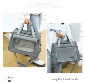 Portable grey breathable pet carrier bag for cats with shoulder strap and mesh windows
