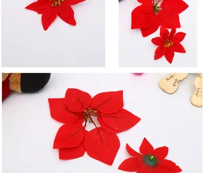 Detailed view of artificial red poinsettia petals and plastic stem for Christmas decor.