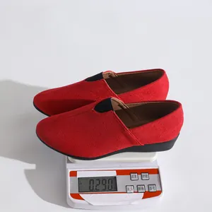 Detailed view of red suede women's pointed slip-on shoes weighing 0.290kg on scale