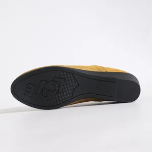 Detail of suede wedge pump sole featuring love pattern and size mark