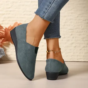 Close-up of comfortable women's faux suede wedge loafers with pointed toe in teal.