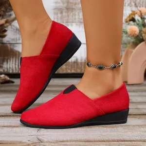 Stylish red suede wedge loafers for women featuring a pointed toe and comfortable slip-on design