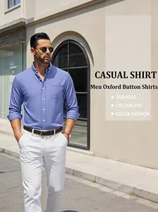 Lifestyle photo of a man in a blue Oxford button-down shirt paired with white pants