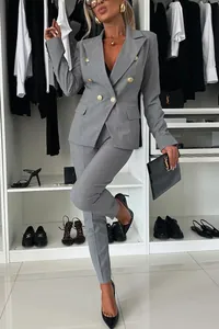 Full view of elegant grey double-breasted blazer and trouser suit for professional women