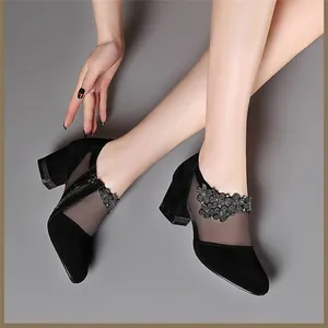 Elegant black mesh ankle boots with chunky heels and rhinestone floral details