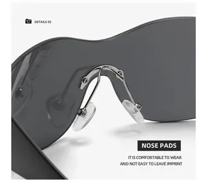 Detailed view of comfortable nose pads on black integrated sunglasses for easy wear.
