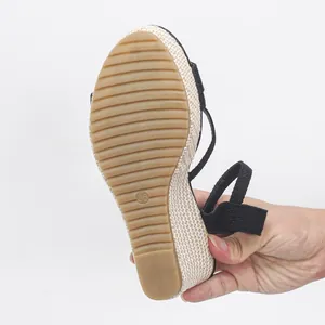 Bottom view of black wedge sandals with jute rope platform and anti-slip sole