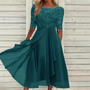 Elegant dark teal chiffon dress with intricate lace bodice and flowing skirt detail
