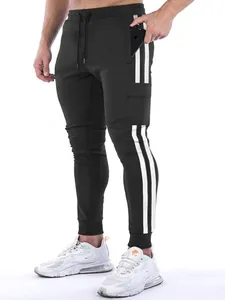 Detailed view showing side stripes and functional pocket of men's athletic joggers.