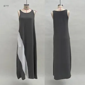 Front and back view of a grey and white sleeveless loose color-block maxi dress