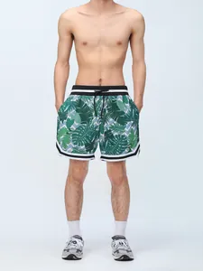 Close-up of men's tropical leaf print sports shorts with comfortable inner lining