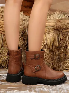 Side view of brown retro motorcycle boots with dual buckle straps and platform sole