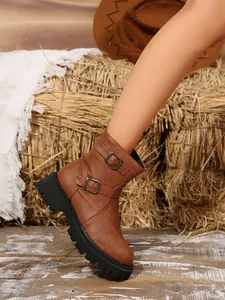 Vintage brown faux leather biker boots with double buckles and thick platform sole