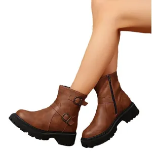 Women's vintage brown motorcycle boots with double buckles and chunky lug sole