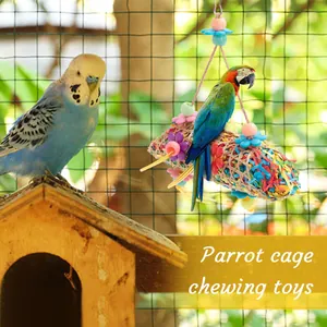 Durable woven parrot cage chewing toy filled with colorful shredded paper decor.