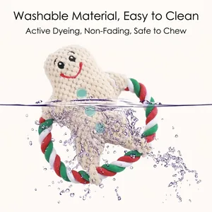 Washable Christmas gingerbread man plush dog toy with durable cotton rope ring for chewing.