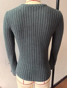 Detail view of the brushed ribbed texture on a grey long-sleeve crew neck top