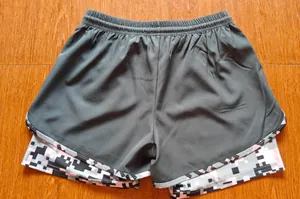 Detailed back view of 2-in-1 women's sports shorts featuring a pixel camo inner layer