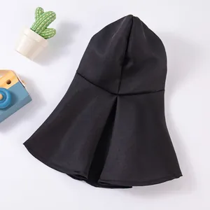 Close-up of black breathable pet hood showing fabric texture and hooded design