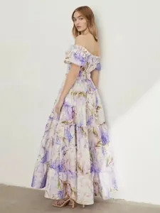 Back view of elegant off-the-shoulder tiered organza maxi dress with floral print