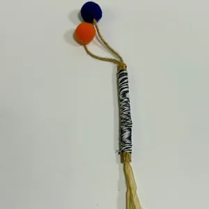 Silvervine cat chew stick toy with colorful pom poms and raffia for dental health