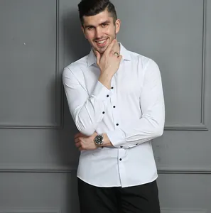 Close-up view of white long-sleeve minimalist business shirt for men with black buttons.