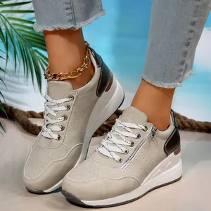 Stylish beige platform sneakers for women featuring a side zipper and lace-up detail.