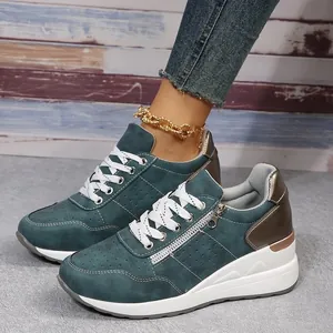 Stylish teal wedge sneakers for women featuring side zipper and thick white platform sole