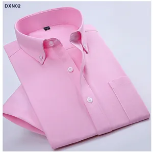 Close-up detail showing the texture and button-down collar of a pink Oxford shirt