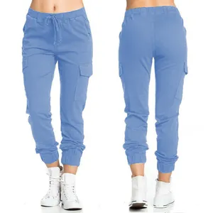 Detailed view of light blue women's cargo pants with elastic drawstring waist and side pockets