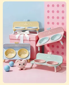 Detailed view of elevated double pet bowls in various pastel colors with neck protection.