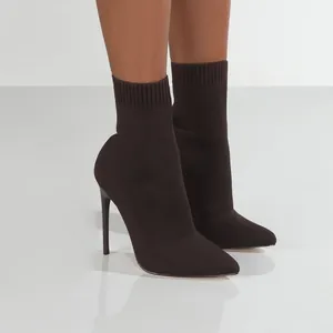 Dark brown knit sock boots featuring a pointed toe and sleek stiletto high heels.