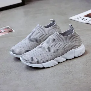 Comfortable lightweight grey fly-knit slip-on sneakers for women with breathable mesh upper