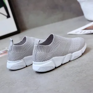 Detailed rear view showing the texture of grey breathable fly-knit slip-on sneakers for women