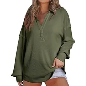 Detailed view of women's olive green long-sleeved polo sweatshirt with V-neck collar design