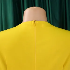 Nahaufnahme des verdeckten Reißverschlusses an einem eleganten gelben Kleid