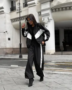 Women's chic black and white color block tracksuit with oversized jacket and pants.