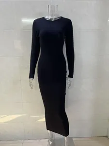 Detailed close-up view showing the black ribbed texture on long-sleeved bodycon maxi dress.