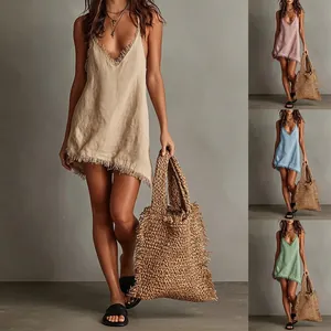 Close-up of V-neck fringe trim mini dress shown in khaki, pink, blue and green options