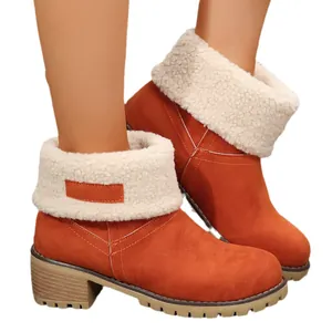 Stylish orange faux suede snow boots for women with thick heels and plush lining