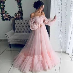 Elegant off-the-shoulder pink mesh long-sleeved evening gown with a layered tulle skirt