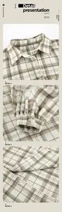 Detailed macro view showing collar, buttoned cuff and fabric texture of a plaid shirt.