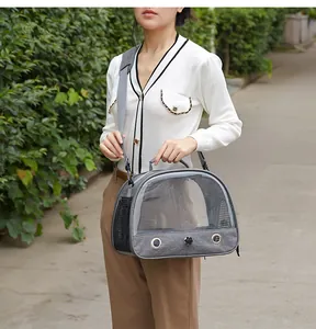 Portable gray pet carrier bag for birds and small animals with a clear front window