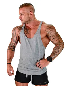 Detailed view of a loose-fit quick-dry gym tank top on a muscular male model.
