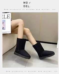 Detailed side view of high-top black snow boots worn by a model in a modern studio