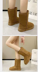 Close-up of brown suede winter snow boots featuring a thick sole and warm lining