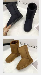 Classic tall winter snow boots for women in black and tan colors with cozy warm fur lining